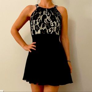 Black cocktail dress with lace detail top